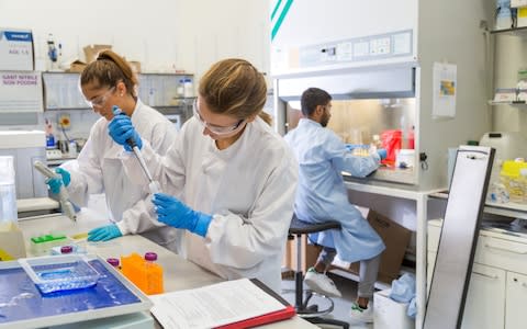 Scientists prepare the magnetic nanoparticles in the lab - Credit: Harry Parvin