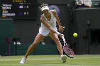 Germany's Tatjana Maria plays a return to Germany's Jule Niemeier in a women's singles quarterfinal match at the Wimbledon tennis championships in London, Tuesday July 5, 2022. (AP Photo/Kirsty Wigglesworth)