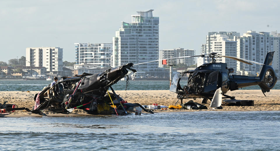 The two helicopters on a sandbank after the crash.