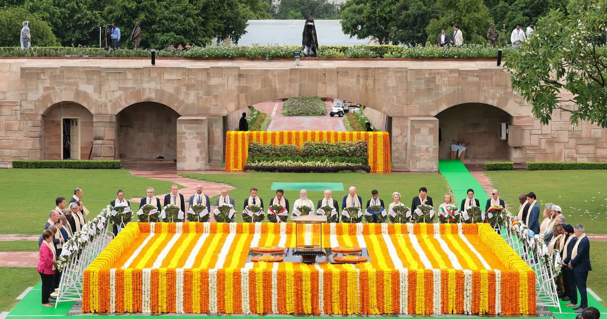 India’s prime minister Narendra Modi, centre, paying homage with other world leaders at Mahatma Gandhi’s memorial in Raj Ghat (EPA)