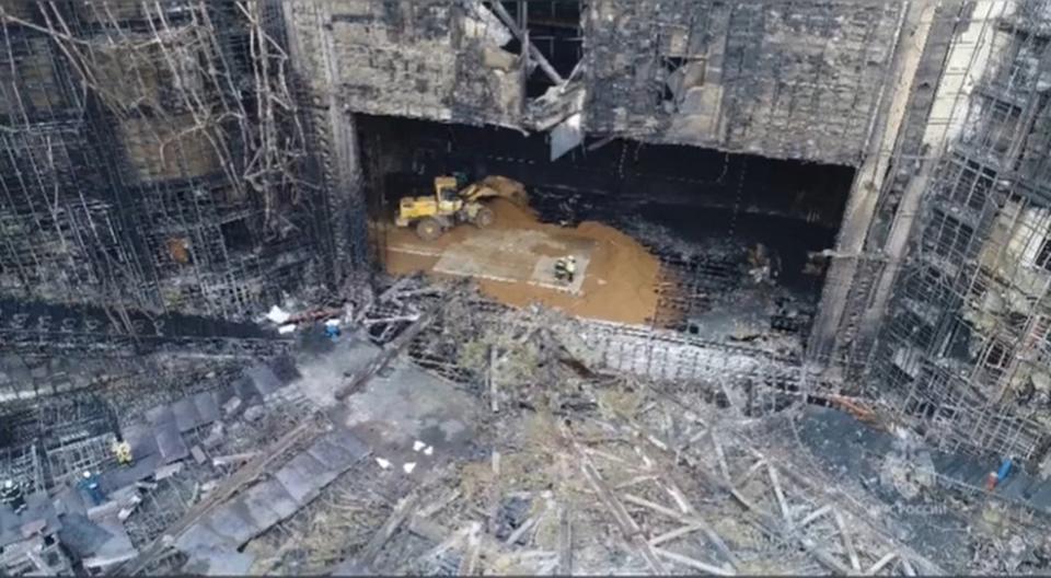 In this photo taken from video released by Russian Emergency Ministry Press Service on Tuesday, March 26, 2024, rescuers work in the burned concert hall after a terrorists attack on the building of the Crocus City Hall on the western edge of Moscow, Russia. Russia is still reeling from the attack Friday in which gunmen killed 139 people in the Crocus City Hall, a concert venue on the outskirts of Moscow. Health officials said about 90 people remain hospitalized, with 22 of them, including two children, in grave condition. (Russian Emergency Ministry Press Service via AP)