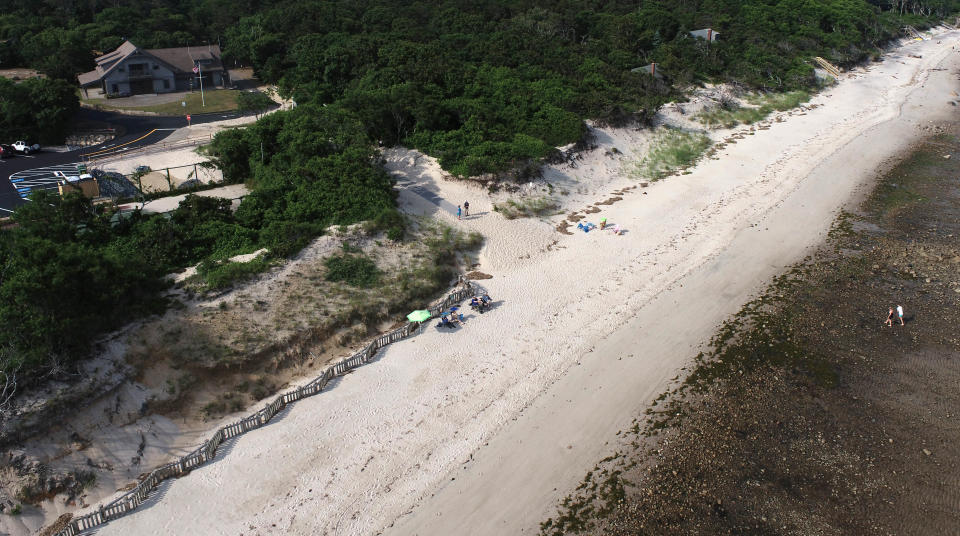 Early arrivals stake out their spots on opening day in this bird's eye view of the First Light Beach in Brewster which opened with visitors and town officials marveling at the opportunity to open a new beach on land-starved Cape Cod. Steve Heaslip/Cape Cod Times