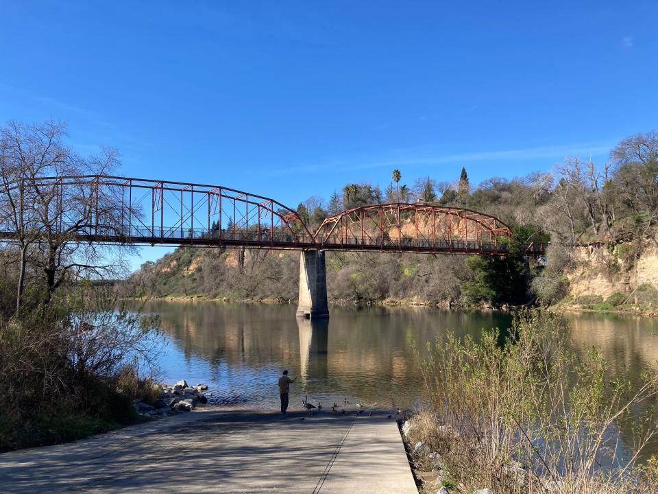 Fair Oaks historic bridge carries bikers or hikers across American River up to old Fair Oaks.