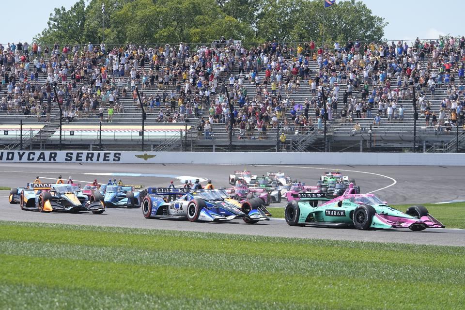 Devlin DeFrancesco, of Canada, leads the field at the start of the IndyCar Indianapolis GP auto race at Indianapolis Motor Speedway, Saturday, Aug. 12, 2023, in Indianapolis. (AP Photo/Darron Cummings)