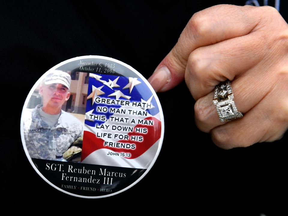 Aurora Fernandez, the mother of Sgt. Reuben Marcus Fernandez III who died Oct. 11, 2008 while serving in the U.S. Army, wore a button in his memory to Dyess Elementary School Friday. The AISD Veterans Memorial Wall was dedicated there during a ceremony