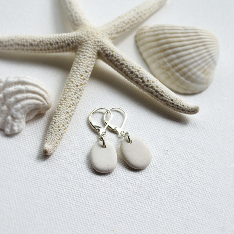 This undated publicity photo provided by Karen Vesk shows earrings made from surf-tumbled ceramic shards. Vesk, of Erie, Penn., hunts for beach glass and pottery shards at the Lake Erie shoreline. She visits Southern states' beaches for small shells and shell fragments, which she says have “an almost sculptural, abstract look to them." (AP Photo/Karen Vesk)