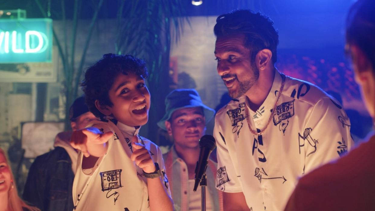  Utkarsh Ambudkar and Manny Magnus performing together in matching shirts in World's Best. 
