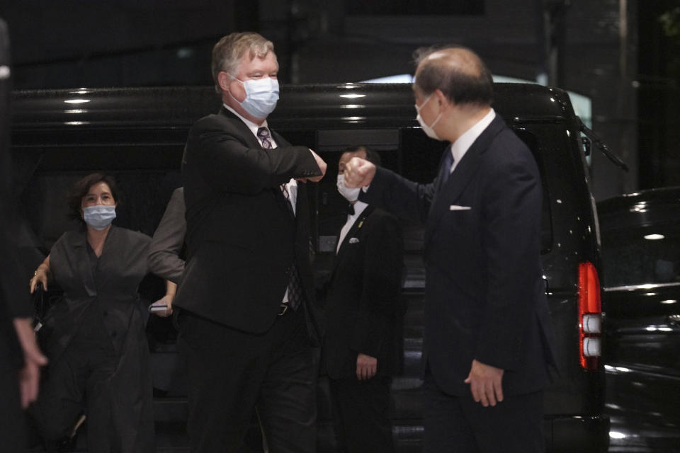 U.S. Special Representative for North Korea Stephen Biegun, left, and Japanese Vice Foreign Minister Takeo Akiba, right, greet each other prior to their bilateral meeting at Iikura Guest House Thursday, July 9, 2020, in Tokyo. (AP Photo/Eugene Hoshiko, Pool)