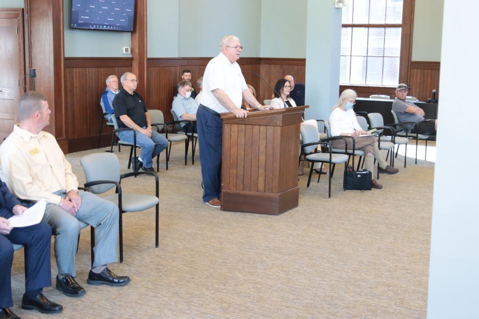 Lenawee County Commissioner Terry Collins, R-Adrian, addresses the Adrian City Commission during its special meeting Monday about Lenawee County's proposed Project Phoenix recreation and events center in Tecumseh.