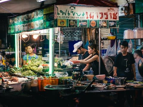 September: the electric buzz of a night-time food market viewed through the lens of Michael Shanta - Credit: Michael Shanta