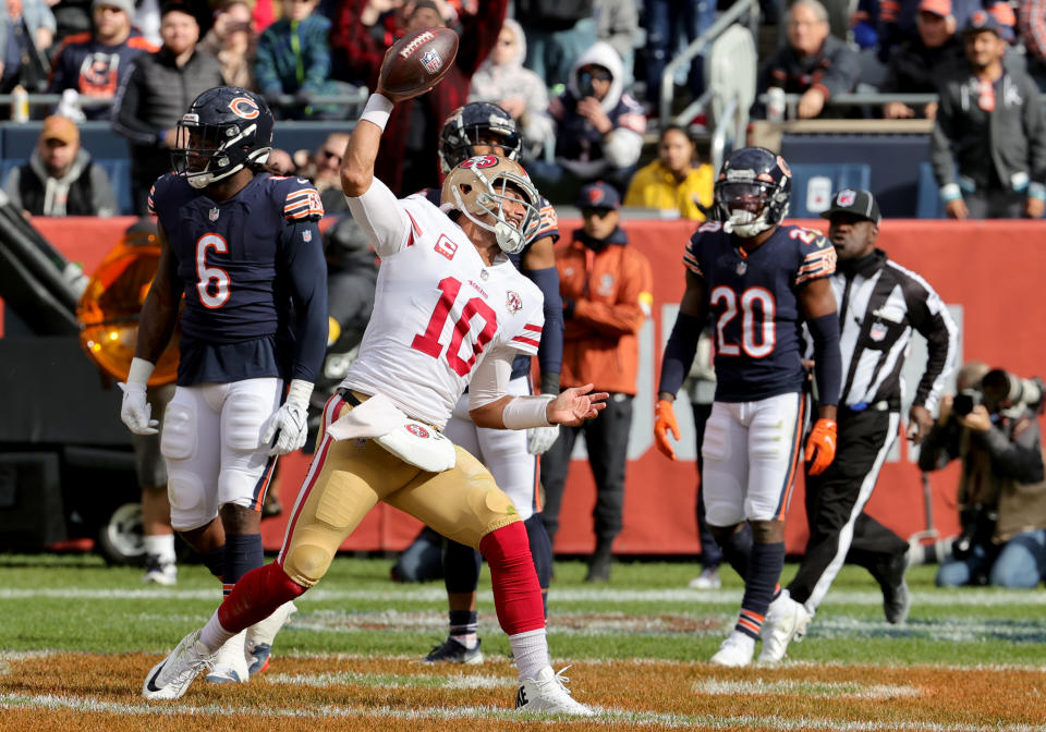 CHICAGO, ILLINOIS - OCTOBER 31: Jimmy Garoppolo #10 of the San Francisco 49ers celebrates after scoring a touchdown in the fourth quarter against the Chicago Bears at Soldier Field on October 31, 2021 in Chicago, Illinois. (Photo by Jonathan Daniel/Getty Images)