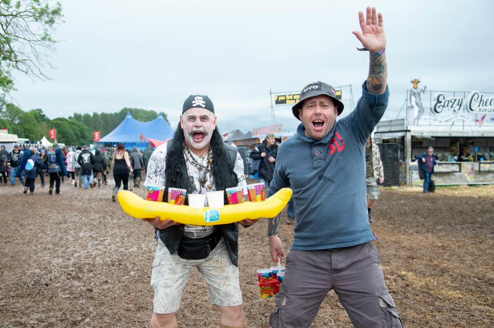 CASTLE DONINGTON, ENGLAND - JUNE 14:  Festival goers brave the muddy fields during day 1 at Download festival 2019 at Donington Park on June 14, 2019 in Castle Donington, England.  (Photo by Joseph Okpako/WireImage)