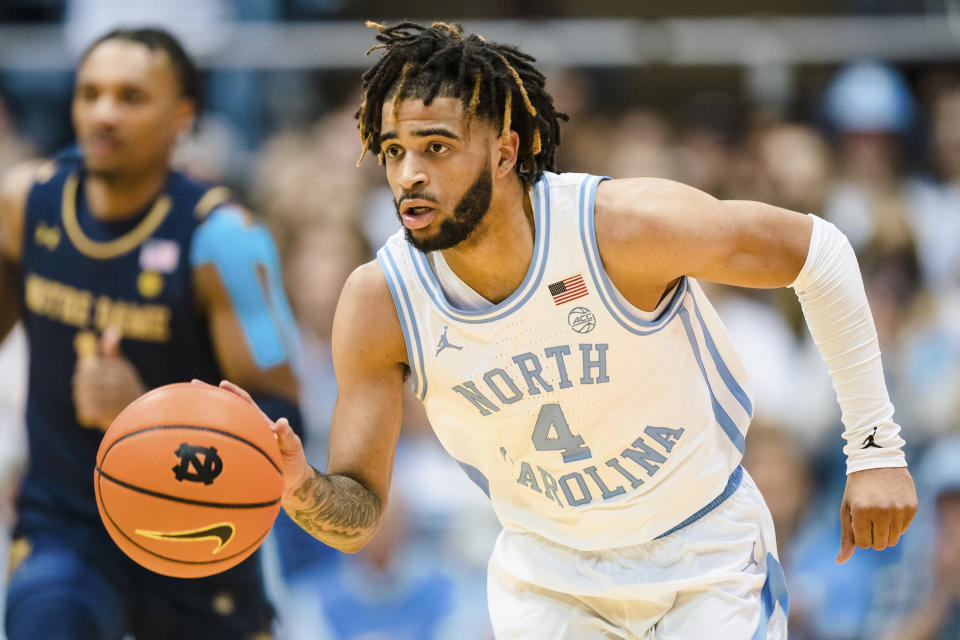 North Carolina guard R.J. Davis (4) brings the ball up court in the first half of an NCAA college basketball game against Notre Dame on Saturday, Jan. 7, 2023, in Chapel Hill, N.C. (AP Photo/Jacob Kupferman)