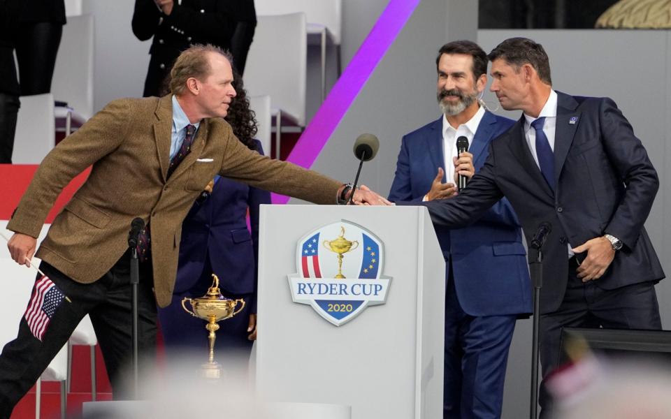  Team USA captain Steve Stricker and Team Europe captain Padraig Harrington shake hands during the opening ceremony for the Ryder Cup at the Whistling Straits Golf Course Thursday, Sept. 23, 2021, in Sheboygan, Wis - AP