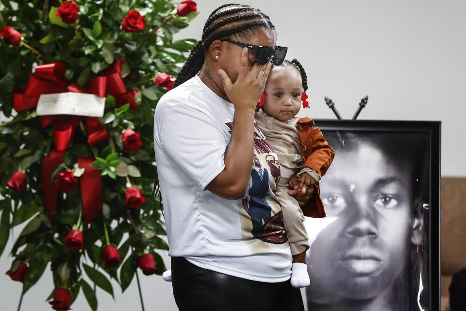 Sierra Rogers, holding her daughter Khloe Rogers, 1, wipes away tears as she speaks during a memorial service for her friend Tyre Nichols on Jan. 17, 2023, in Memphis, Tenn.  (Mark Weber / Daily Memphian via AP)