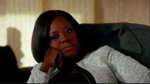 Annalise Keating from "How to Get Away with Murder" sitting back in her chair annoyed