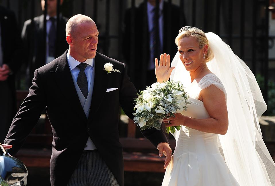 Mike Tindall and Zara Phillips step out of Canongate Kirk on Edinburgh's Royal Mile as man and wife   (Photo by Owen Humphreys/PA Images via Getty Images)