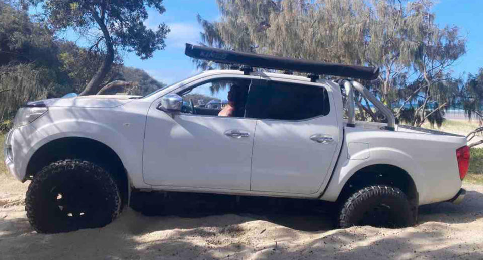 Dave sitting in his beloved white 4WD.