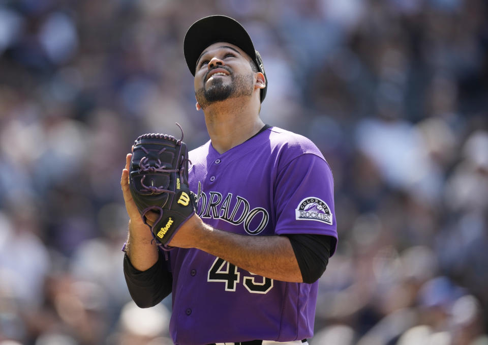 Colorado Rockies starting pitcher Antonio Senzatela walks to the dugout after being hit by a single off the bat of Chicago White Sox's Leury Garcia in the seventh inning of a baseball game Wednesday, July 27, 2022, in Denver. (AP Photo/David Zalubowski)