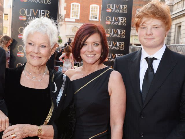 <p>David M. Benett/Getty</p> Judi Dench, Finty Williams, and Sam Williams at the Laurence Olivier Awards in 2014