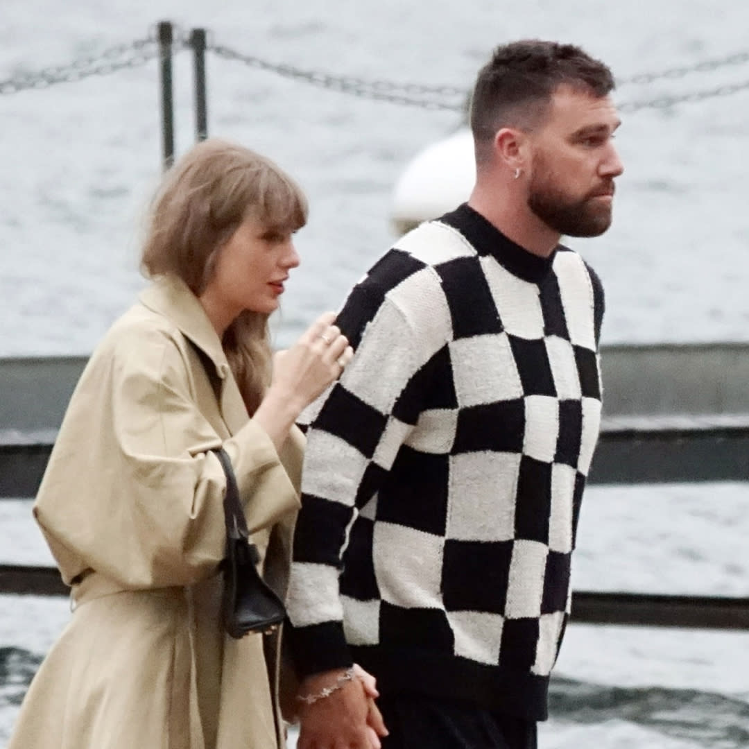  Taylor Swift and Travis Kelce in Lake Como where Taylor Swift wears a trench coat and carries a black Versace bag to match her black dress. 