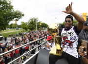 Toronto Raptors guard Kyle Lowry waves to fans while holding the Larry O'Brien Championship Trophy during the 2019 Toronto Raptors NBA basketball championship parade in Toronto, Monday, June 17, 2019. (Photo by Andrew Lahodynskyj/The Canadian Press via AP)