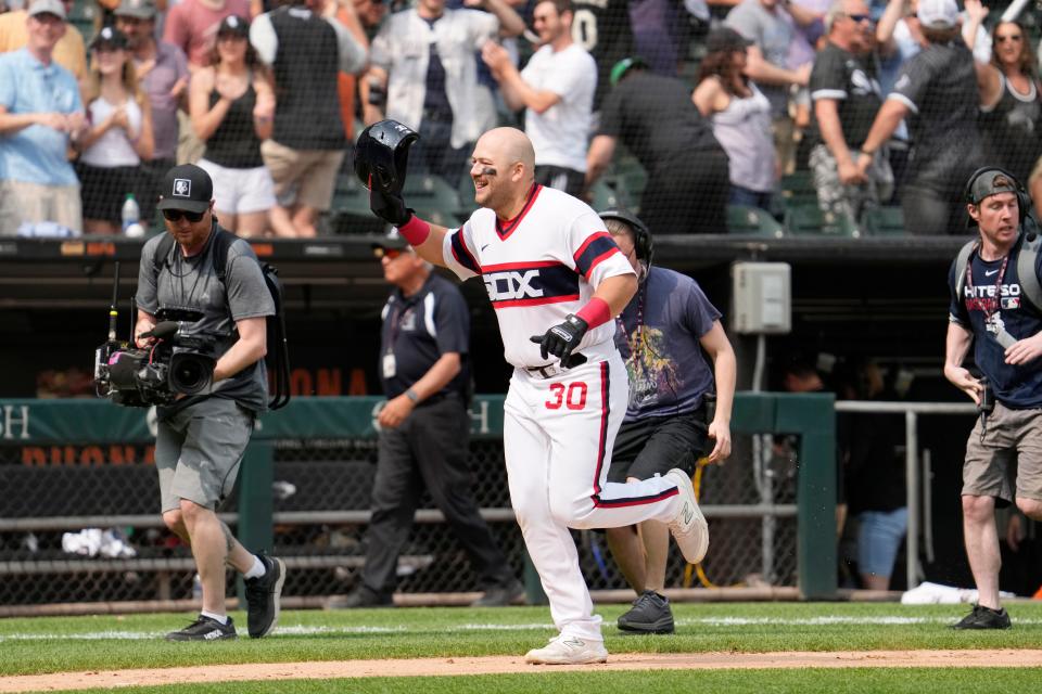 Chicago White Sox's Jake Burger smiles as he rounds the bases after hitting a grand slam during the ninth inning of a baseball game against the Detroit Tigers in Chicago, Sunday, June 4, 2023. The White Sox won 6-2.