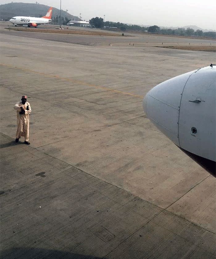 Angry passenger stops flight by standing on runway