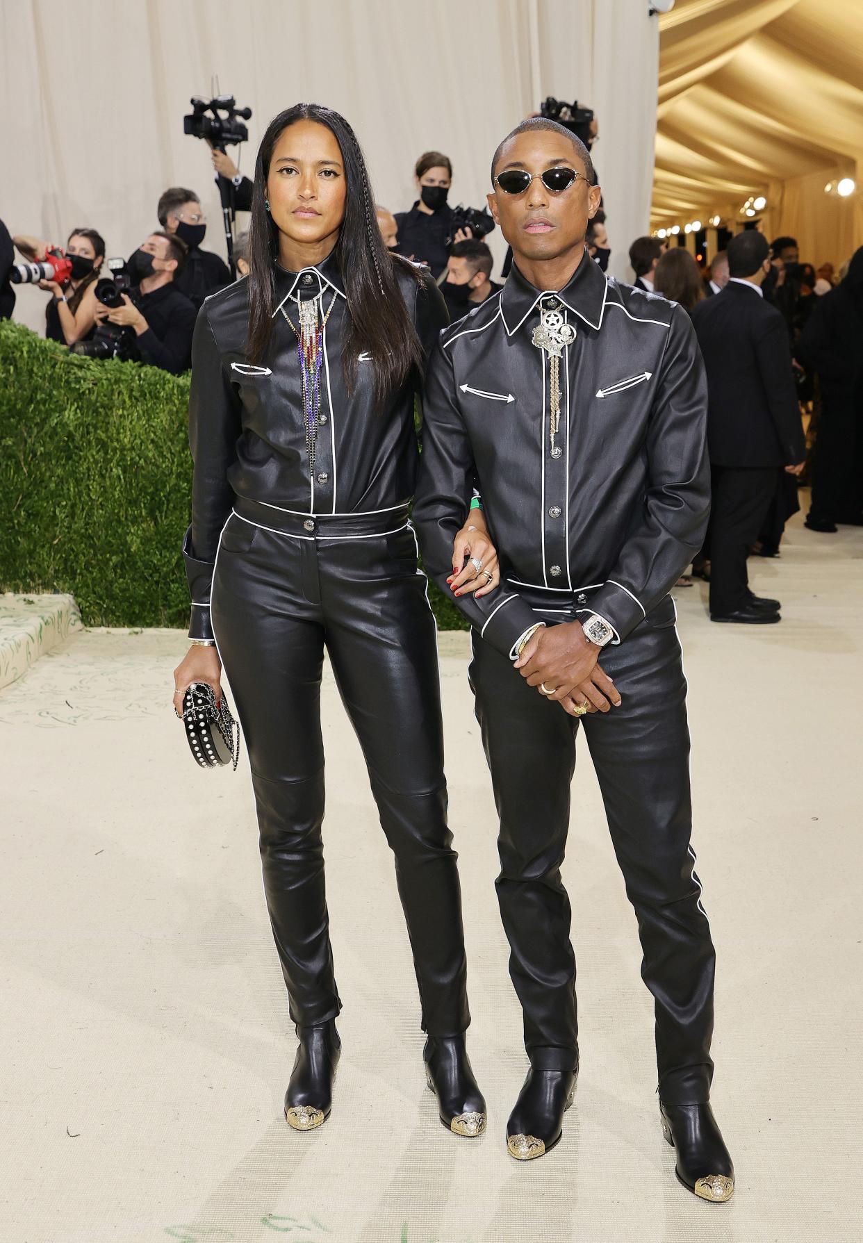 Helen Lasichanh and Pharrell Williams attend The 2021 Met Gala Celebrating In America: A Lexicon Of Fashion at Metropolitan Museum of Art on Sept. 13, 2021 in New York.