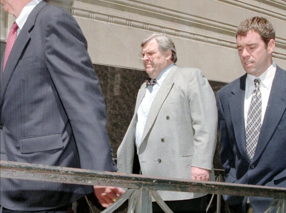 Former Detroit Tigers pitcher Denny McLain, center, walks into the federal courthouse in Detroit, Wednesday, May 7, 1997, where he was sentenced for pension fund theft. McLain and a business partner were sentenced in connection with skimming more than $3 million from their company's union pension fund. (AP Photo/Maurice Harris) ORG XMIT: ORG XMIT: MER0703231659252031
