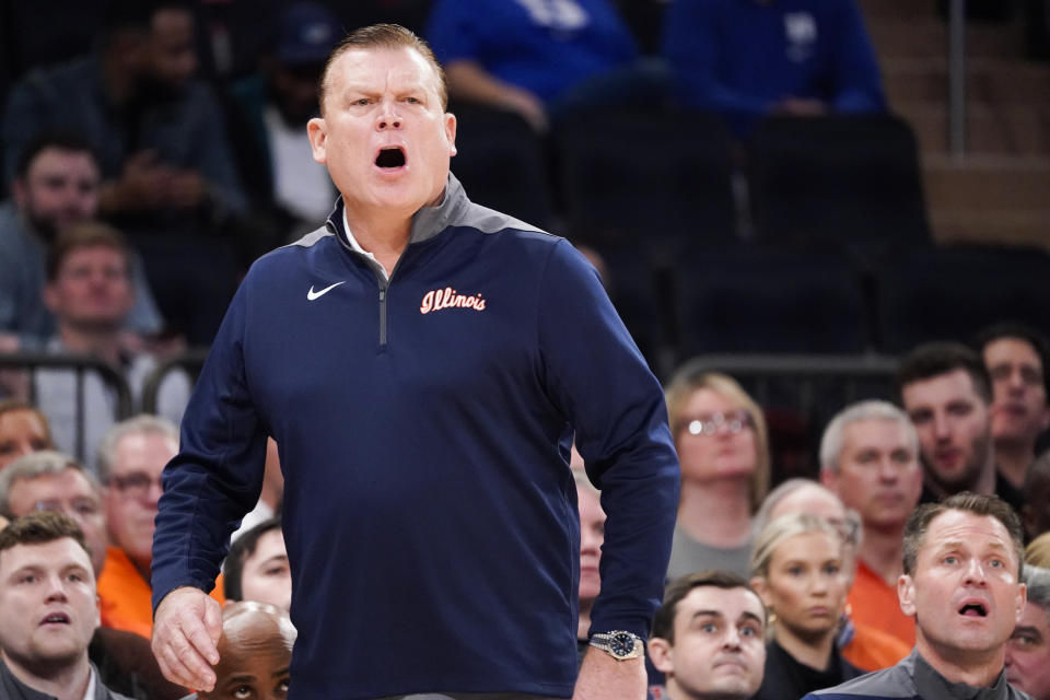 Illinois head coach Brad Underwood works the bench during the first half of the team's NCAA college basketball game against Texas in the Jimmy V Classic, Tuesday, Dec. 6, 2022, in New York. (AP Photo/John Minchillo)