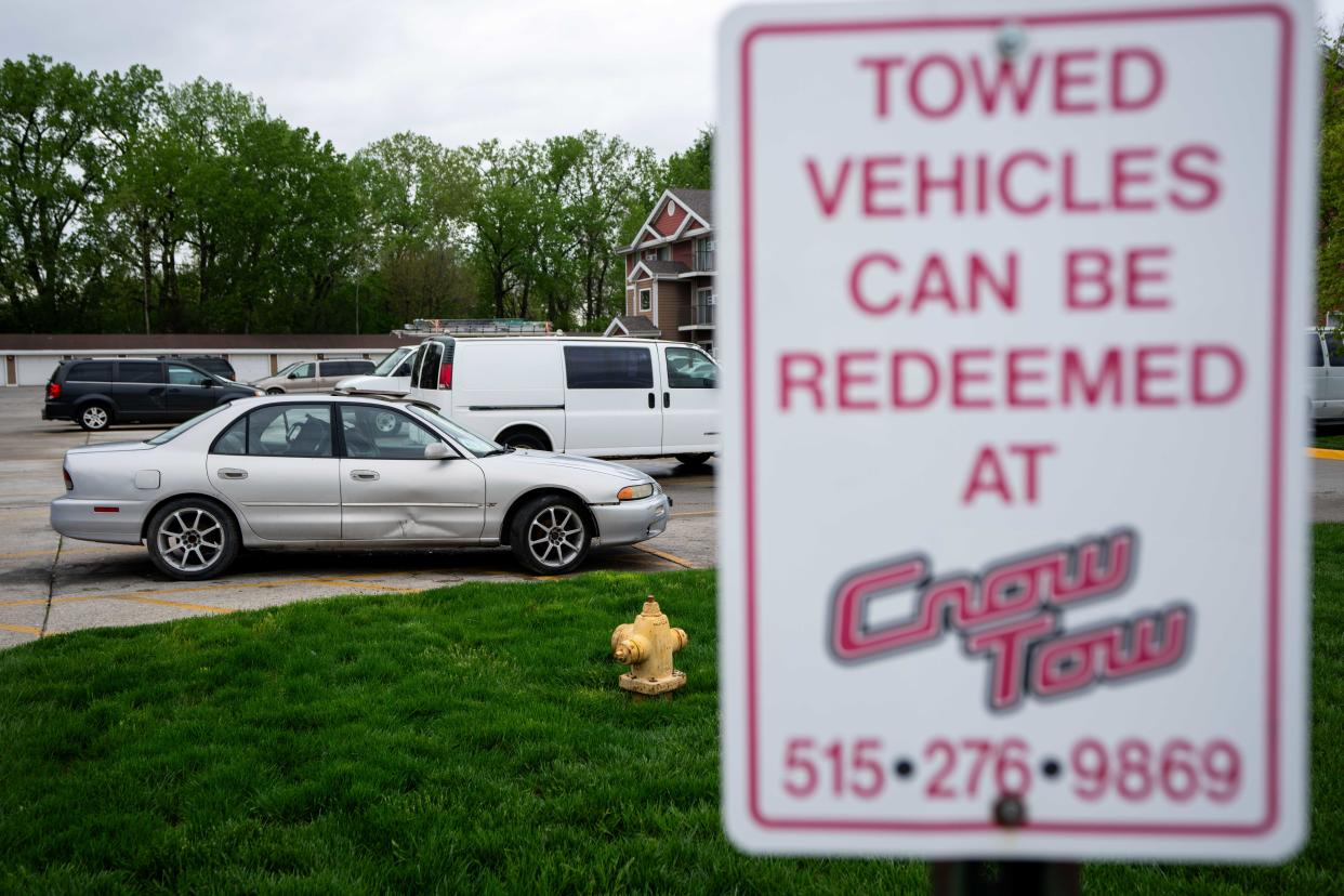 A Crow Tow sign in an apartment complex parking lot in Des Moines.
