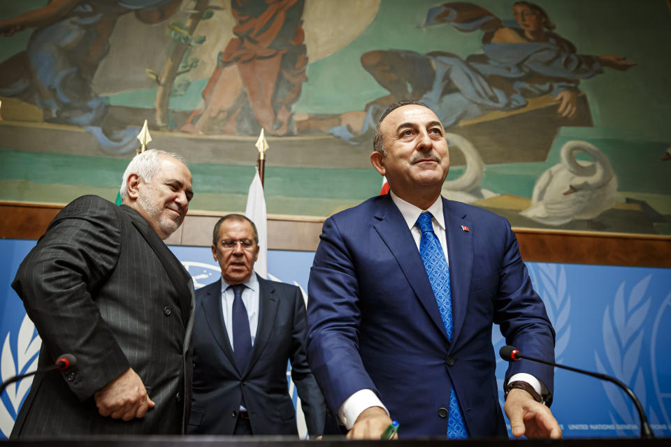 From left to right: Iranian Foreign Minister Mohammad Javad Zarif, Russian Foreign Minister Sergei Lavrov and Turkish Foreign Minister Mevlut Cavusoglu leave after a press conference a day prior to the Syrian Constitutional Committee meeting in Geneva, at the European headquarters of the United Nations in Geneva, Switzerland, Tuesday, Oct. 29, 2019. Representatives from the Syrian government, opposition and civil society are to begin meeting in Geneva on Wednesday. (Valentin Flauraud, Keystone via AP)