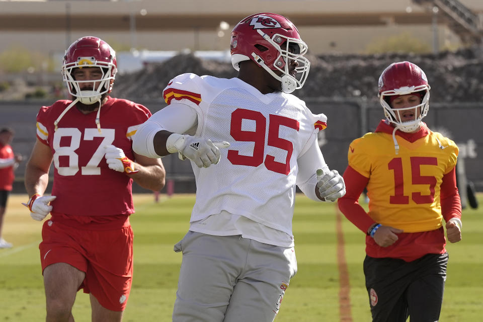 Kansas City Chiefs tight end Travis Kelce (87), defensive tackle Chris Jones (95) and quarterback Patrick Mahomes (15) run during practice for Super Bowl 58 Thursday, Feb. 8, 2024 in Henderson, Nev. The Chiefs will play the NFL football game against the San Francisco 49ers Sunday in Las Vegas. (AP Photo/Charlie Riedel)