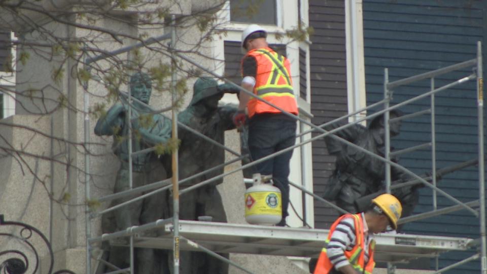 Artist Morgan MacDonald is seen here on Thursday morning, refurbishing the statues that represent the merchant marine and the forestry companies that served during the First World War. 