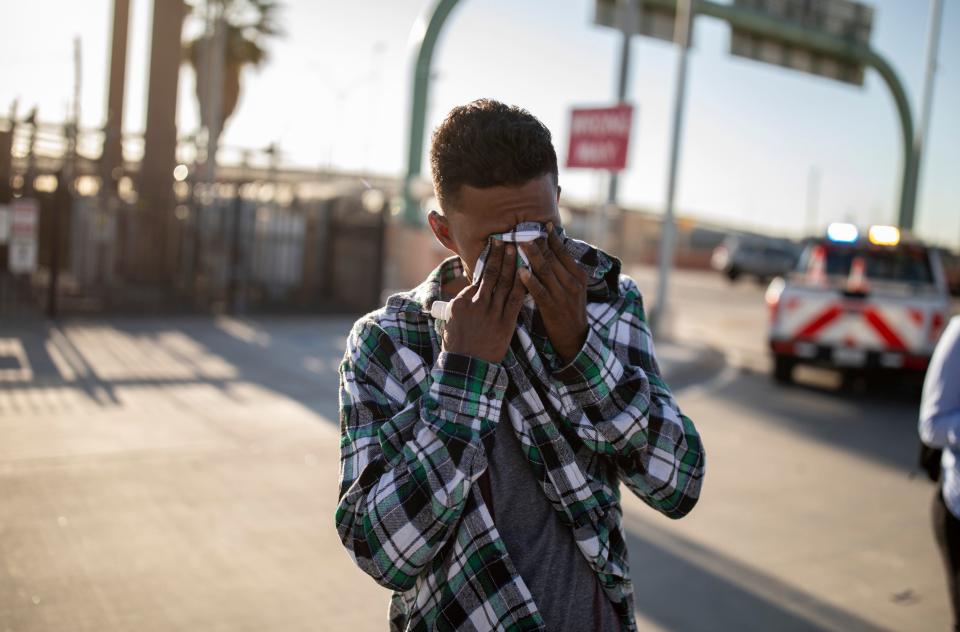 A migrant from Venezuela wipes away his tears as he debates turning himself in at U.S. Customs and Border Protection substation at the Paso Del Norte bridge in El Paso, Texas, Tuesday, May 9, 2023. The gentleman was so scared of what would happen if he turned himself in that he began to cry. Migrants were encouraged by CBP agents to turn themselves in with flyers left on the sidewalk in the early morning as migrants slept outside Sacred Heart Church.