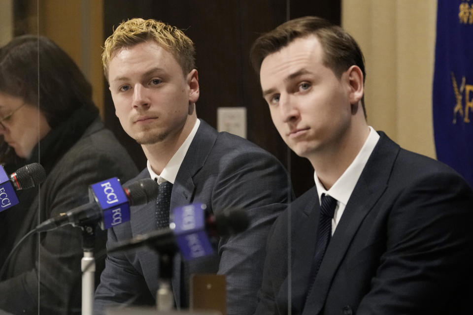 Ukraine's YouYubers Sava Tkachov, right, and his young brother Yan Tkachov attend a news conference at the Foreign Correspondents Club of Japan in Tokyo, Thursday, March 31, 2022. Ukrainian YouTuber duo Sawayan, popular among young Japanese for their funny videos and chat over Mario Kart games, are now using their platform to share the reality of war in Ukraine and send an antiwar message. (AP Photo/Shuji Kajiyama)