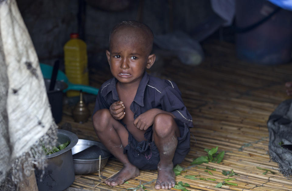 In this Sept. 17, 2013 photo, a Muslim boy, who become displaced following the 2012 sectarian violence, cries at Nga Chaung refugee Camp in Pauktaw, Rakhine state, Myanmar. President Thein Sein traveled to Myanmar's conflict-torn west on Tuesday, Oct. 1, 2013 as a new spate of sectarian violence gripped the state of Rakhine, with police saying Buddhist rioters killed a 94-year-old Muslim woman and torched more than 70 homes. (AP Photo/Gemunu Amarasinghe)