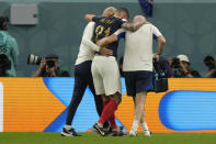 France's Lucas Hernandez is helped off the pitch during the World Cup group D soccer match between France and Australia, at the Al Janoub Stadium in Al Wakrah, Qatar, Friday, Nov. 4, 2022. (AP Photo/Frank Augstein)