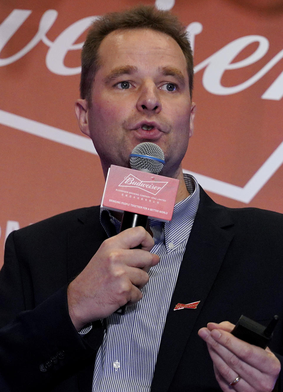 Jan Craps, Executive Director and CEO of Budweiser Brewing Company APAC Limited speaks during a press conference in Hong Kong Tuesday, Sept. 17, 2019. AB InBev, the world's largest brewer that produces Budweiser and Corona, has revived plans to list its Asian business in Hong Kong despite persistent pro-democracy protests but halved the size of its initial public offering. (AP Photo/Vincent Yu)
