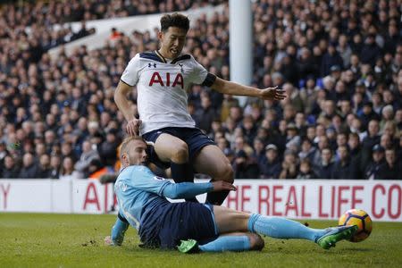 Britain Football Soccer - Tottenham Hotspur v Swansea City - Premier League - White Hart Lane - 3/12/16 Tottenham's Son Heung-min in action with Swansea City's Mike van der Hoorn Action Images via Reuters / Andrew Couldridge Livepic