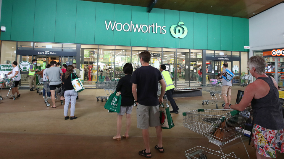 Woolworths shoppers standing outside store