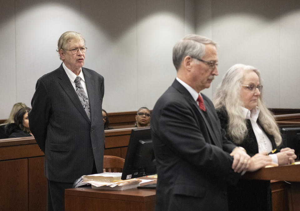 Assistant Attorney General Richard Cunningham, left, addresses the court as Kathy Funk and her attorney Philip H. Beauvais III listen during a hearing, Wednesday, Jan. 25, 2023, in Flint, Mich. Funk, who was a public official in a Flint-area community admitted, Wednesday that she broke a seal on a ballot box to ensure that votes could not be recounted in her 2020 race, prosecutors said Brice Tucker. Funk, 59, pleaded no contest to misconduct in office, a felony, under an agreement that includes no time in jail. (Brice Tucker/The Flint Journal via AP)