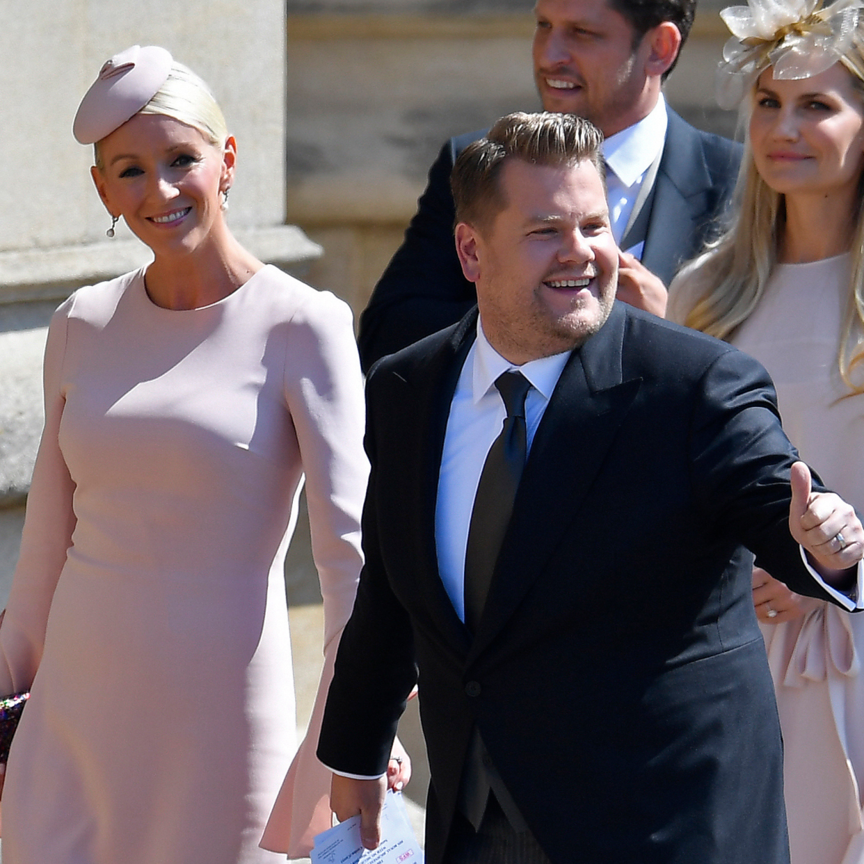  British presenter James Corden and Julia Carey arrive for the wedding ceremony of Britain's Prince Harry, Duke of Sussex and US actress Meghan Markle at St George's Chapel, Windsor Castle, in Windsor, on May 19, 2018.  