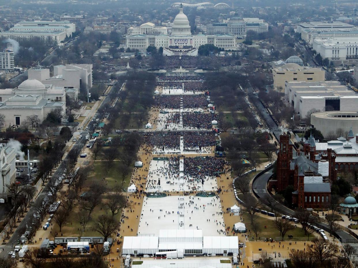 Crowds attending the inauguration ceremonies to swear in U.S. President Donald Trump at 12:01pm (L) on January 20, 2017 a: Reuters