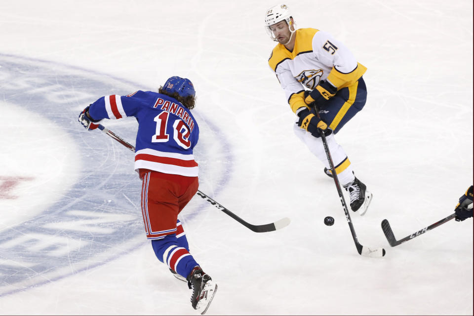 Nashville Predators left wing Austin Watson (51) defends against a pass by New York Rangers left wing Artemi Panarin (10) during the third period of an NHL hockey game, Monday, Dec. 16, 2019, in New York. The Predators defeated the Rangers 5-2. (AP Photo/Kathy Willens)