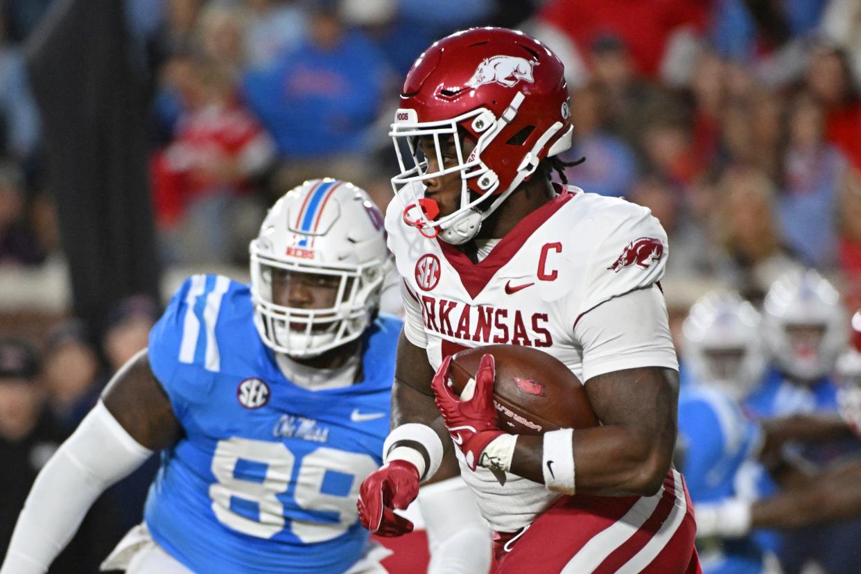 Arkansas running back Raheim Sanders, right, runs the ball during the first half of an NCAA college football game against Mississippi in Oxford, Miss., Saturday, Oct. 7, 2023. (AP Photo/Thomas Graning)
