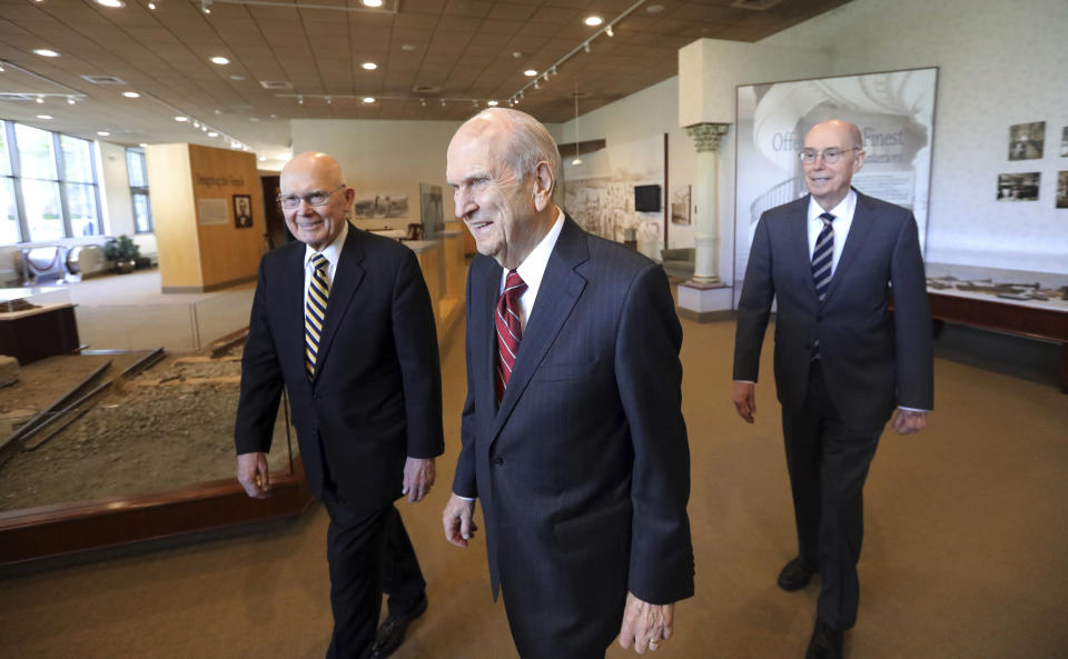 The Church of Jesus Christ of Latter-day Saints President Russell M. Nelson, center, walks with his counselors, Dallin H. Oaks, left, and Henry B. Eyring, right, as they arrive for a news conference at the Temple Square South Visitors Center Friday, April 19, 2019, in Salt Lake City. An iconic temple central to The Church of Jesus Christ of Latter-day Saints faith will close for four years to complete a major renovation, and officials are keeping a careful eye on construction plans after a devastating fire at Notre Dame cathedral in Paris. Nelson said the closure will begin in December. (AP Photo/Rick Bowmer)