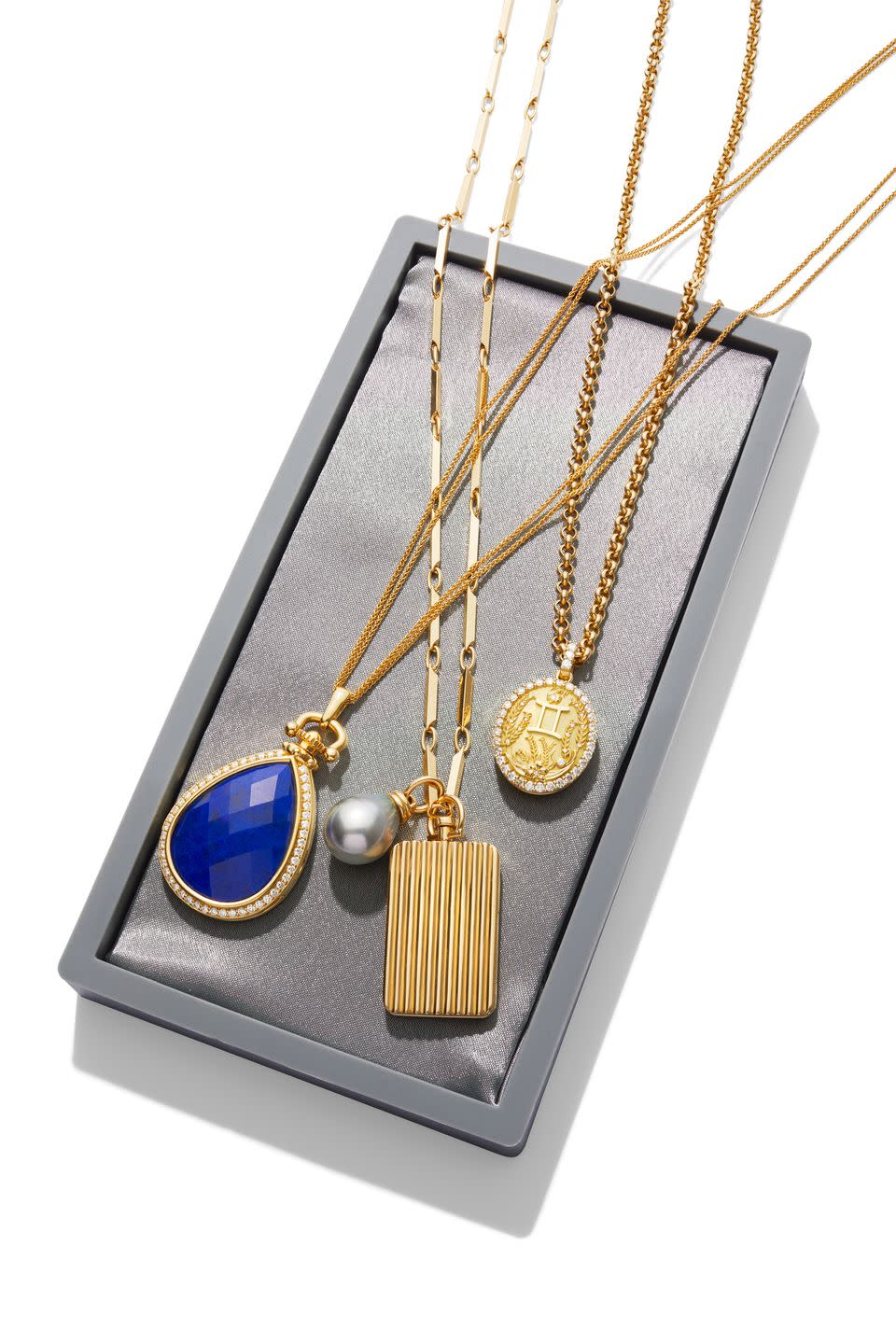 monica rich kosann lapis necklace $24,250, monicarichkosanncom sherman field locket $9,070, tahitian pearl $4,130, and column chain $21,040, shermanfieldcom briony raymond locket necklace $13,300, brionyraymondcom