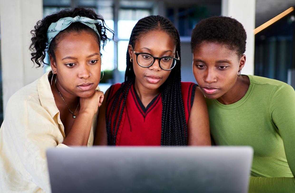 Some colleges and universities have put race-based scholarships on hold. <a href="https://www.gettyimages.com/detail/photo/three-african-american-students-concentrated-using-royalty-free-image/1987353122?phrase=black+college+students+on+campus+serious&adppopup=true" rel="nofollow noopener" target="_blank" data-ylk="slk:Carlos Barquero via Getty Images;elm:context_link;itc:0;sec:content-canvas" class="link ">Carlos Barquero via Getty Images</a>